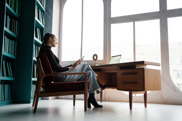 Office work uses a tablet a woman is a formal clothing manager
concept office