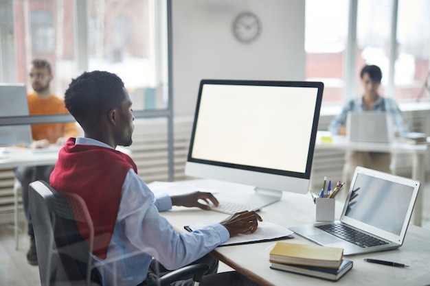 Office worker by desk