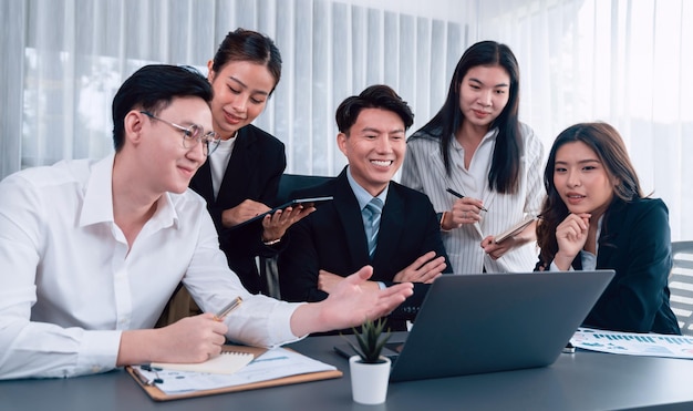 Office worker and manager analyze financial report paper in harmony workplace