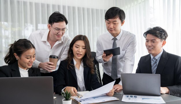 Office worker and manager analyze financial report paper in harmony workplace