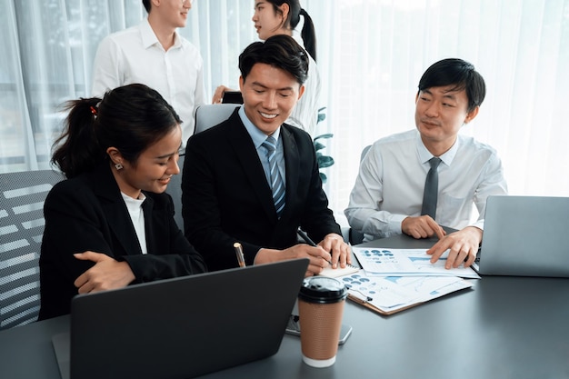 office worker and manager analyze financial report paper in harmony workplace