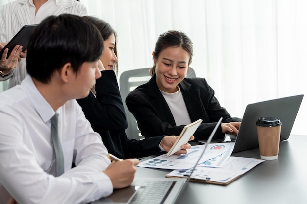 Office worker and manager analyze financial report paper in harmony workplace