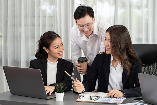 Office worker and manager analyze financial report paper in harmony workplace