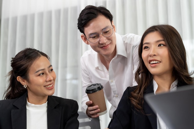 Office worker and manager analyze financial report paper in harmony workplace