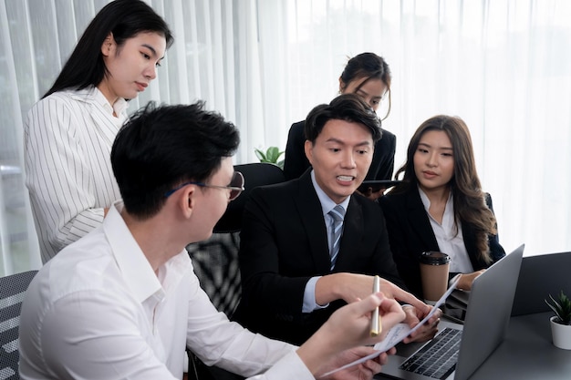 Office worker and manager analyze financial report paper in harmony workplace