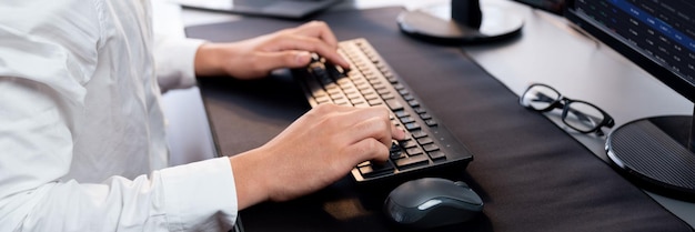 Photo office worker sitting on workspace desk typing on keyboard trailblazing