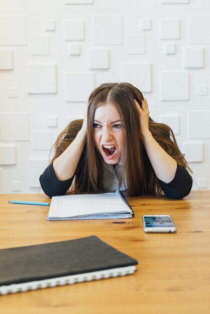 Office worker of student/teacher in troubles. raised hands near head and screaming, negative human emotions, angry scarred face.Made mistake