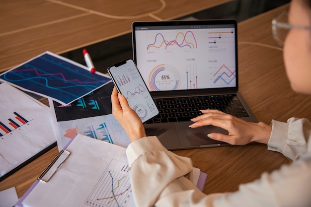 Photo office worker using finance graphs