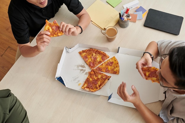 Office Workers Eating Pizza