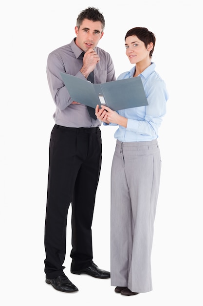 Office workers holding a binder