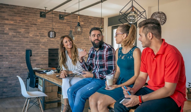 Office workers talking sitting at the table