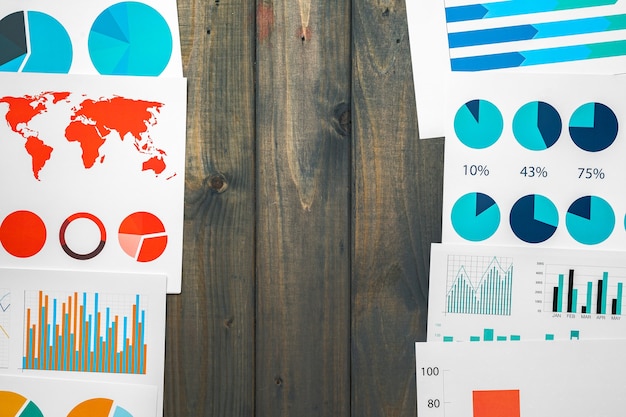 Photo office workplace table with report pages with financial data