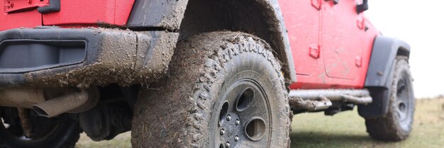 Offroad car concept with dirty road wheel closeup outdoor adventures and travel suv car tire