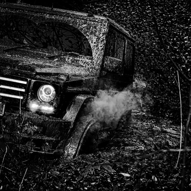 Offroad vehicle coming out of a mud hole hazard road adventure adventure travel mudding is offroadin