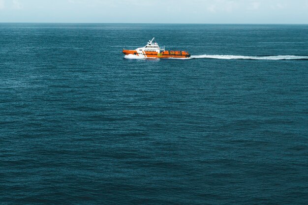 Offshore supply boat offshore in a calm weather day