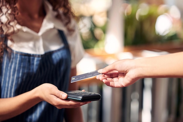 Oh definitely tap Shot of a customer using a card and an NFC scanner to make a card payment