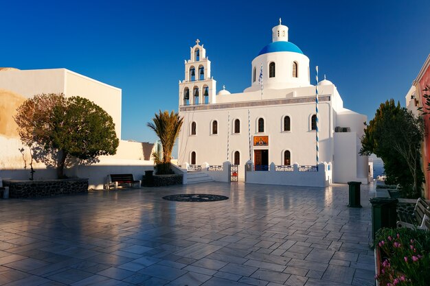 Oia or ia at sunset, santorini, greece