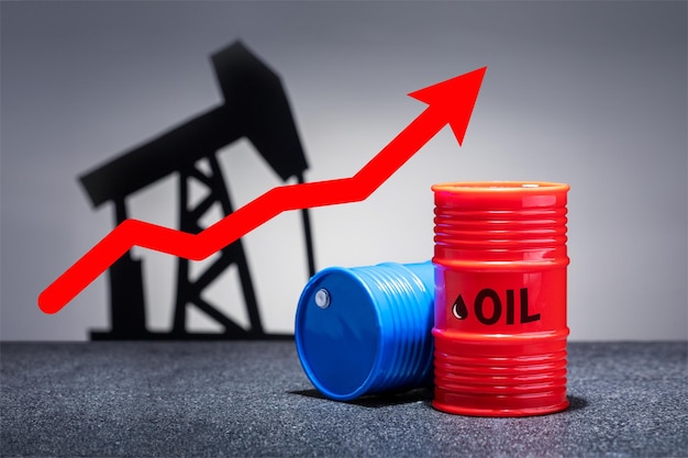 Oil barrels with a red up arrow on grey background Oil chart