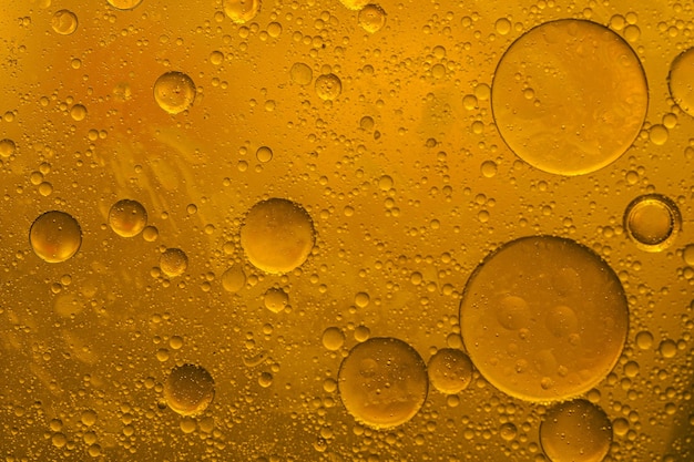 Oil bubbles in a glass of beer