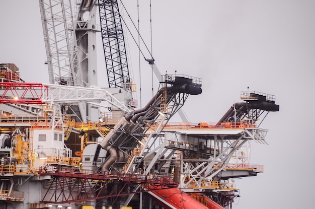 Oil Drilling Rig Silhouette over a Cloudy Sky