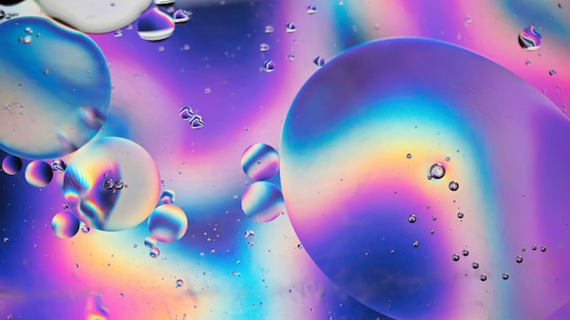 Oil drops in water abstract psychedelic pattern image rainbow colored abstract background with colorful gradient colors dof