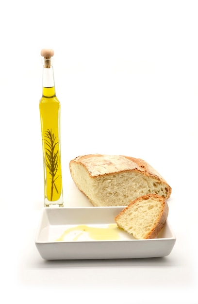 Oil flavored with rosemary branch and slice of bread