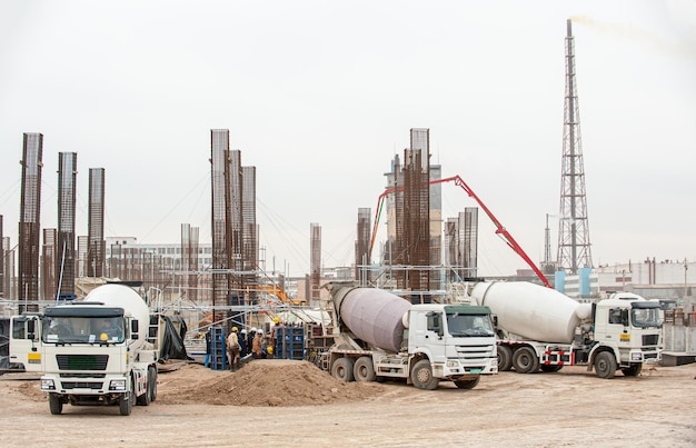 An oil and gas industry with an industrial construction view\
with tracks and tools outdoors