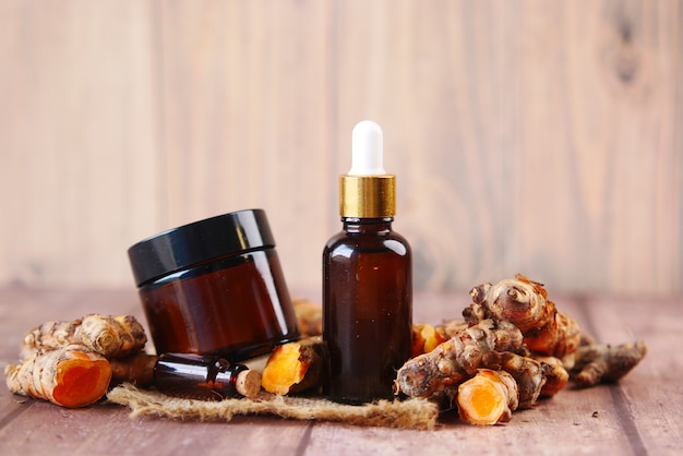 Oil of ginger in a glass bottle on table