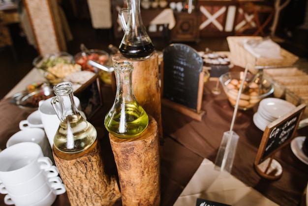 Oil in glasses at the buffet table