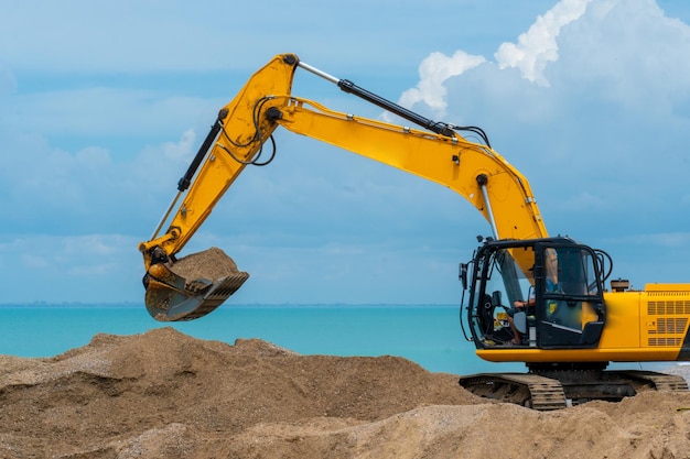 Oil industry heavy machine sea excavator construction sand silhouette business from mining bucket for excavation and power earth yellow excavate Excavating working stone stone