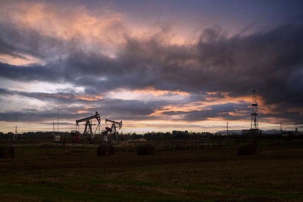 Oil industry. Oil rigs. oil pumps at sunset. Copy space.