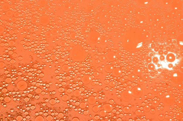 Oil in orange water