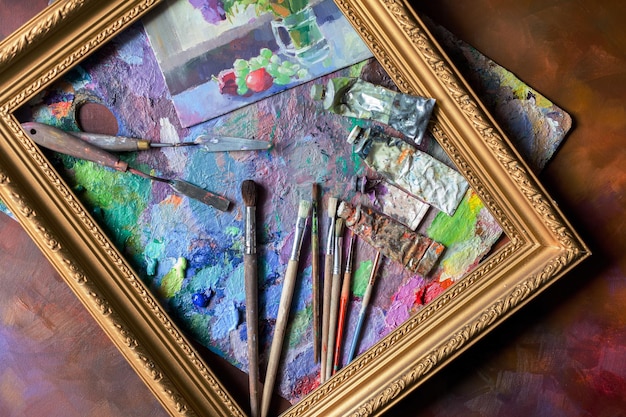 Photo oil paints and paint brushes on a palette