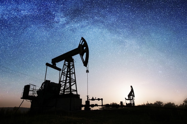 Oil pump on the oil field in the night