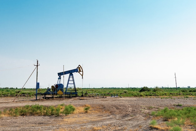 Photo oil pump in steppe