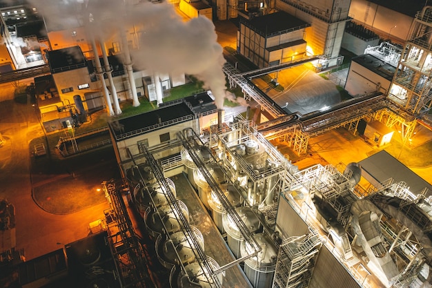 Oil refinery at night. Heavy industry. Aerial photography