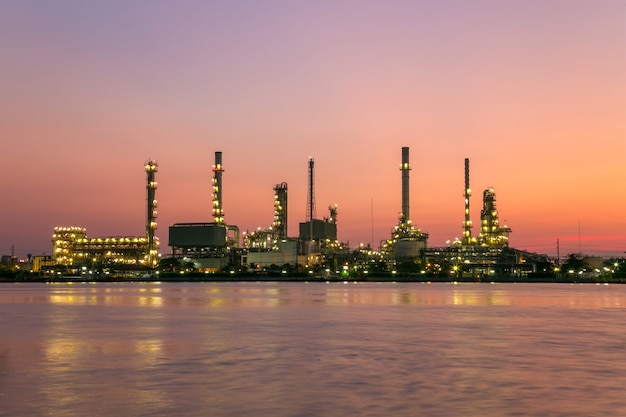 Oil refinery plant from industry, petrochemical oil and gas refinery and pipeline industry with sunrise sky.