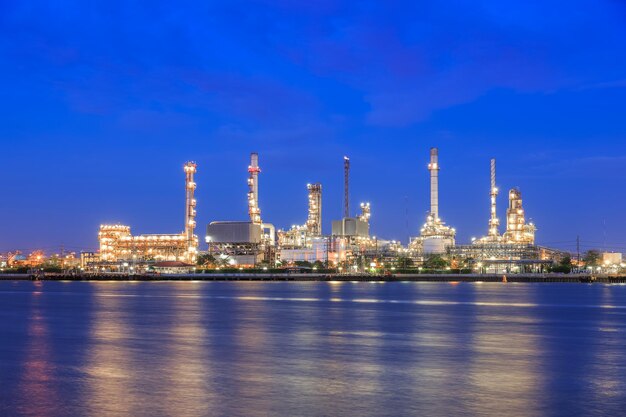 Oil refinery on water front at twilight