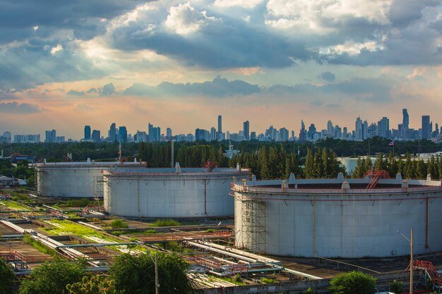 Oil storage tank floating roof big with oil refinery plant background cityscape