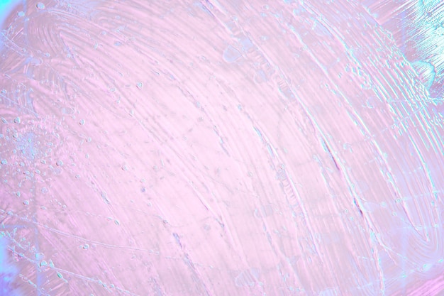 Oil with bubbles on pink blue  neon background. Abstract  background.