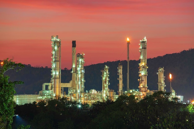 Oilâ refineryâ andâ plant of petrochemistry industry in oilâ andâ gasâ âindustry withâ cloudâ âsky the sunset backgroundâ.