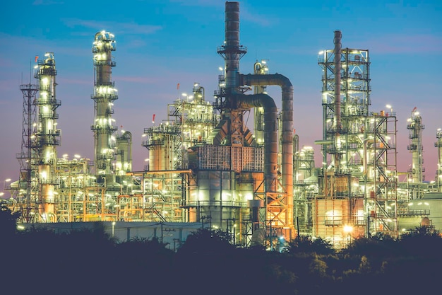 Oilâ refineryâ andâ plant and tower of Petrochemistry industry in oilâ andâ gasâ âindustry withâ cloudâ blueâ âsky the morningâ backgroundâ