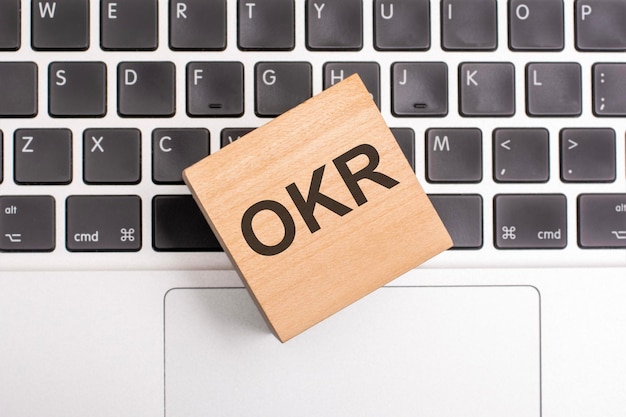 OKR inscription concept on cube on keyboard