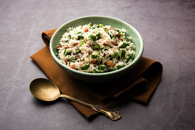 Okra or Bhindi rice also known as Vendakkai Sadam, served in a bowl, selective focus