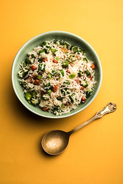 Okra or Bhindi rice also known as Vendakkai Sadam, served in a bowl, selective focus