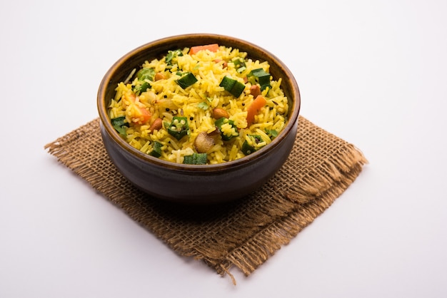 Okra or Bhindi rice also known as Vendakkai Sadam, served in a bowl, selective focus