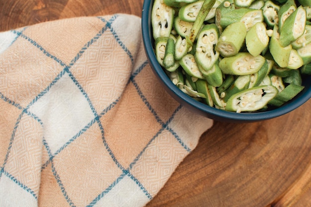 Okra in a boa on a cloth seen from above