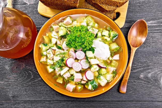 Okroshka in bowl on black board top