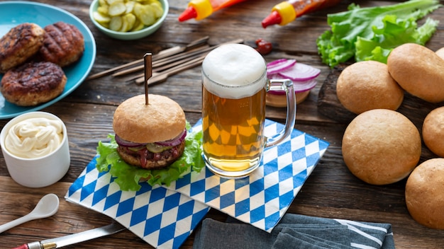 Oktoberfest beer and burgers on wooden table