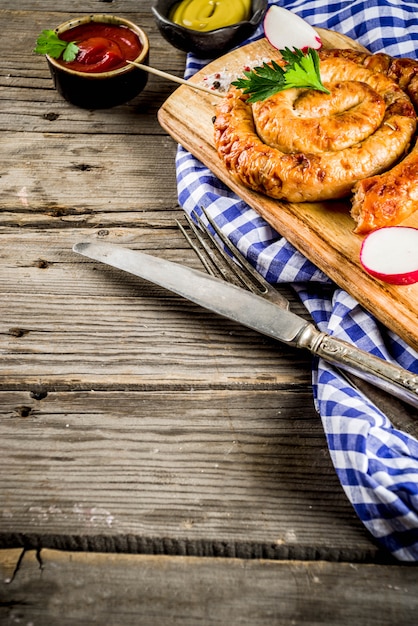 Oktoberfest food menu, bavarian sausages on wooden table,